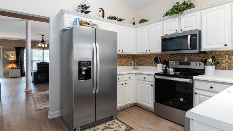 A large refrigerator in a fitted kitchen